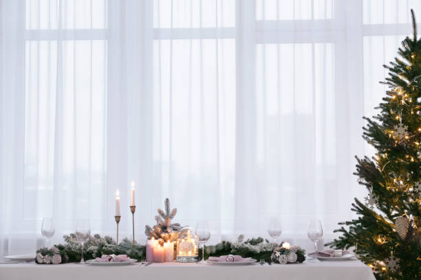 istock Beautiful festive table setting with Christmas decor in room 1804411619