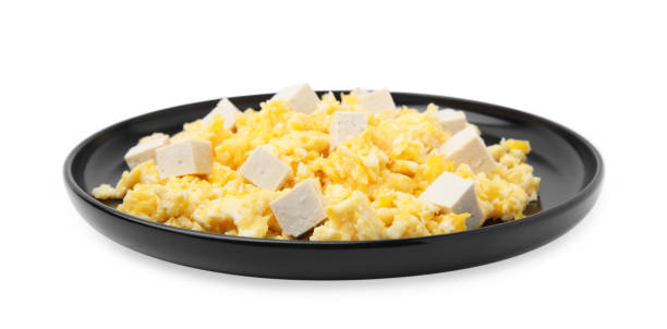 istock Plate of delicious scrambled eggs with tofu isolated on white 1804411657