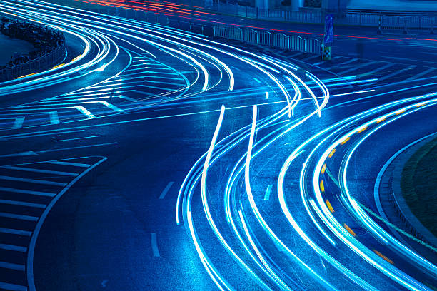 istock light trails on the urban road 180441599