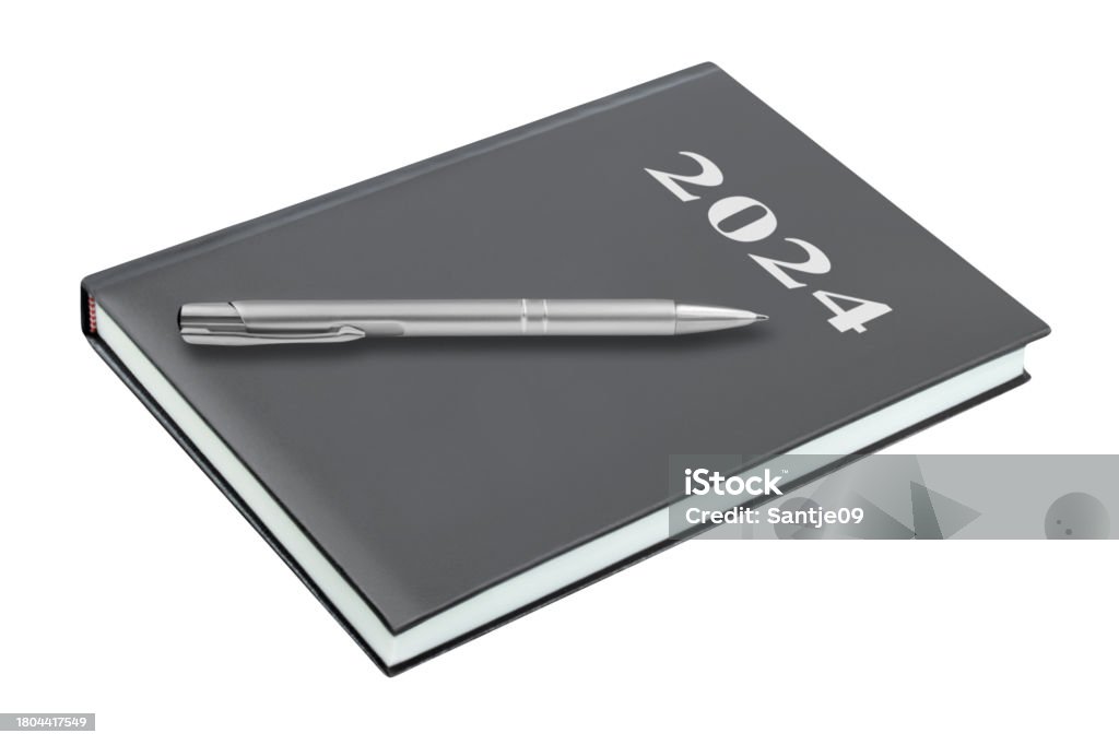 Calendar book 2024 and pencil isolated on white background Book Stock Photo