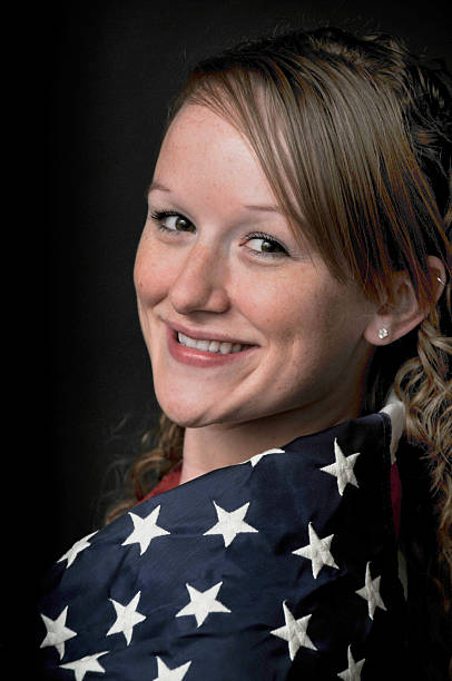 istock Woman Wrapped in a Flag 180442930