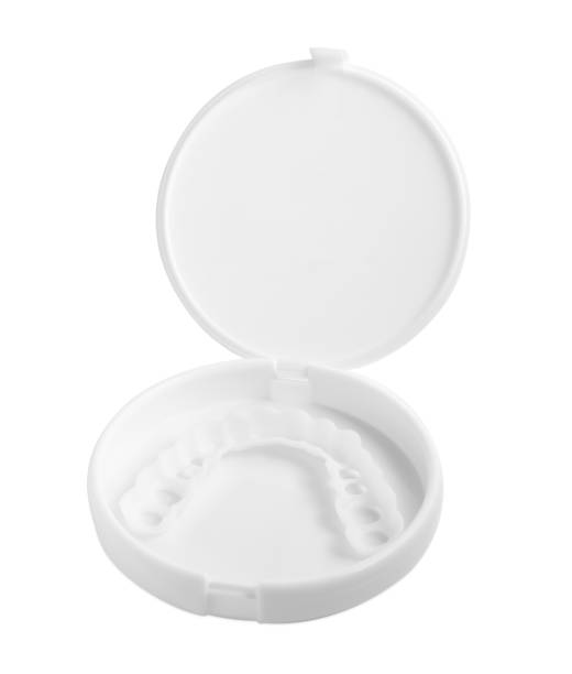 istock Container with dental mouth guard isolated on white. Bite correction 1804432078
