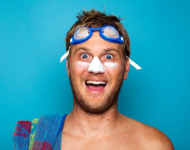 Happy blonde man excited to go swimming in Summertime stock photo