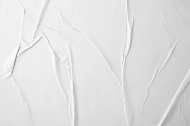 istock Texture of white creased paper, closeup view 1804450862