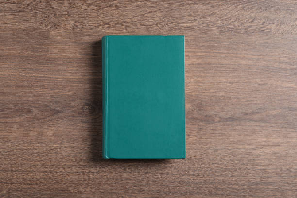 istock Hardcover book on wooden table, top view 1804451925