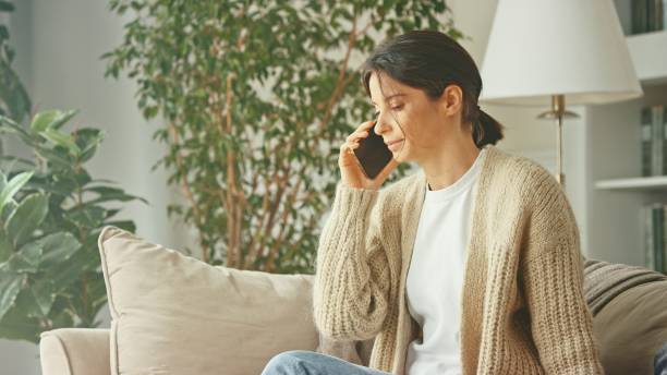 istock A young beautiful woman relax on sofa 1804462915