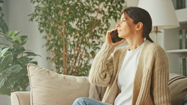 istock A young beautiful woman relax on sofa 1804463799