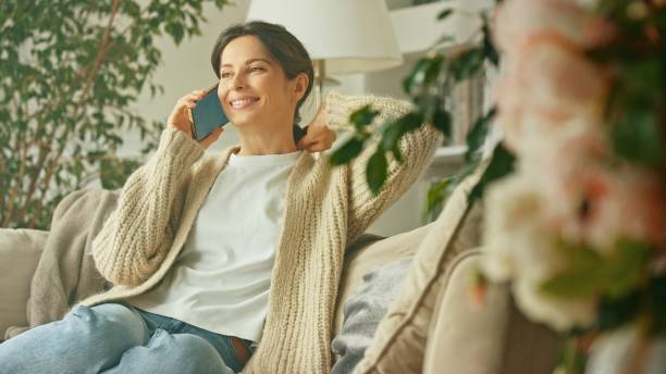 istock A young beautiful woman relax on sofa 1804464482