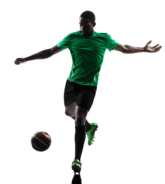 istock african man soccer player silhouette 180446571