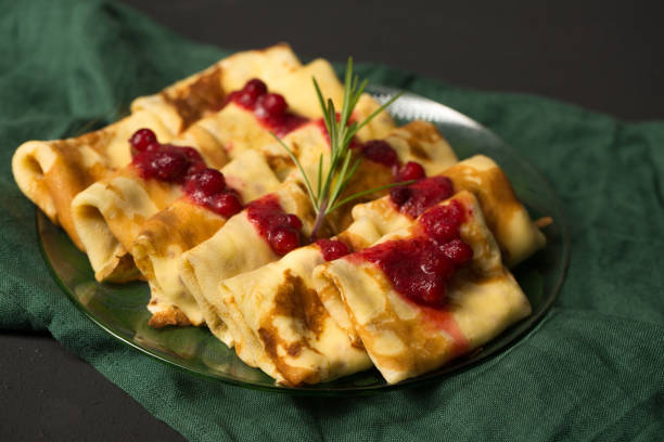 istock Pancakes stuffed with cheese with cranberry sauce 1804479462