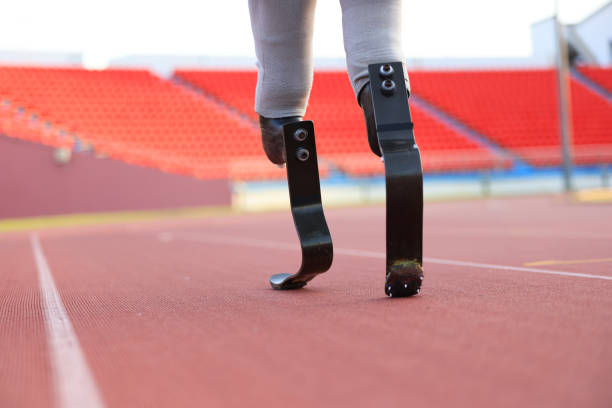 istock Close-up Athlete with a Disability running  Through Outdoor Esplanade 1804485557