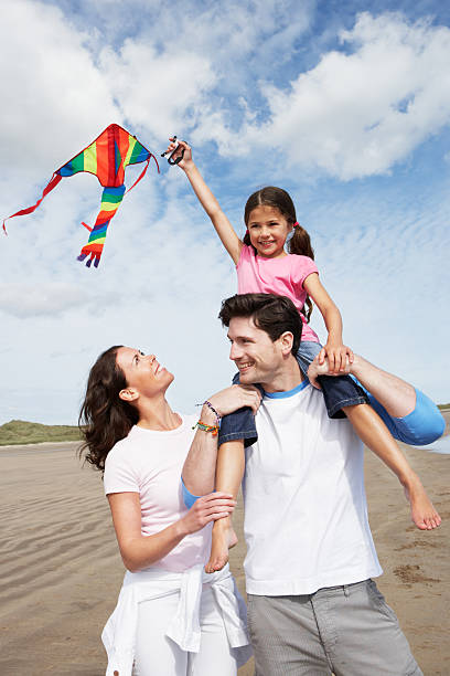istock A family of three flying a kite 180448939