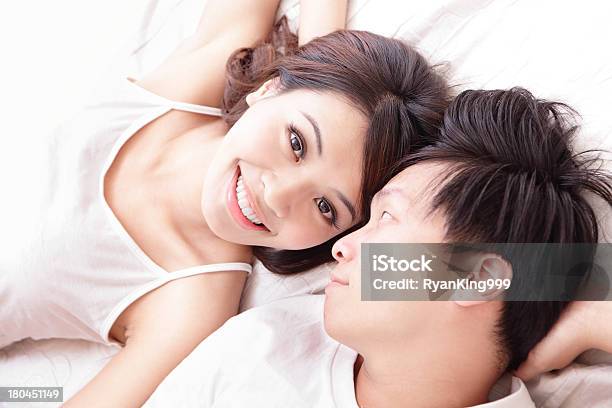 Couple Happy Smile Looking To Each Other In Bed Stock Photo - Download Image Now - Asian and Indian Ethnicities, Bed - Furniture, Couple - Relationship