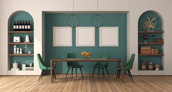 Dining room with wooden table , green leather chairs two niches with decor objects on a green wall - 3d rendering