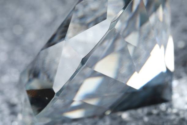 istock Large dazzling brilliant on shiny silver surface, closeup 1804524619
