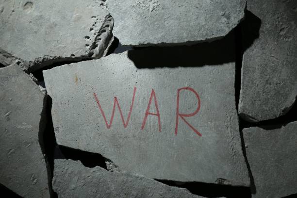 istock Word War written on piece of concrete, top view 1804524644