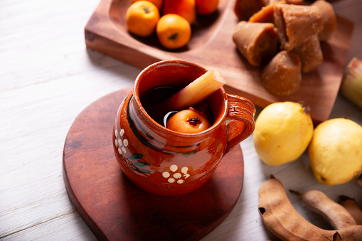 Mexican Ponche. Christmas fruit punch is a hot fruit-infused drink, traditionally consumed in the winter season during posadas and Christmas Eve. Made with sugar cane, piloncillo and fruits.