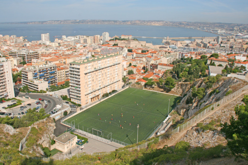 View of buildings and soccer field in Marseille. Picture shot from Notre dame de la garde basilica.