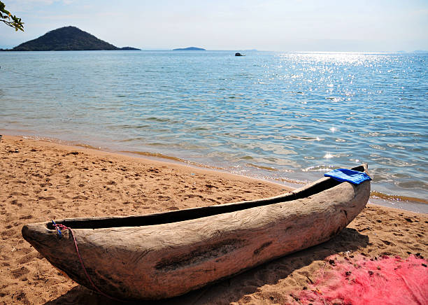 istock Cape Maclear, Chembe, Malawi: hand carved pirogue on the beach 180453932