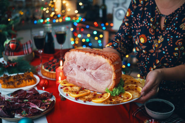 istock Christmas Dinner with Baked Glazed Ham and Various Vegetables 1804549928