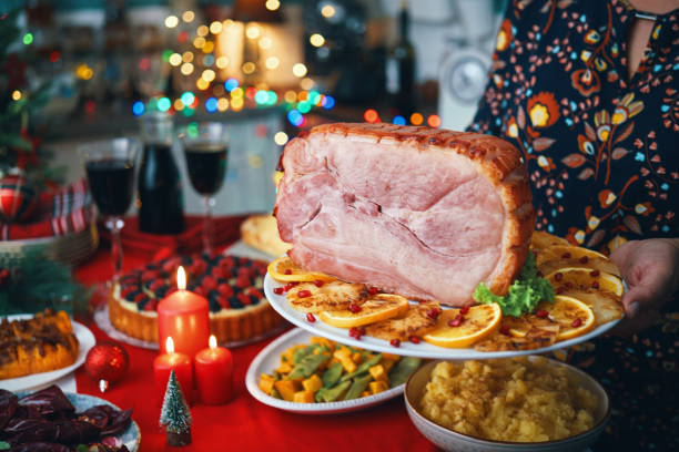 istock Christmas Dinner with Baked Glazed Ham and Various Vegetables 1804549930