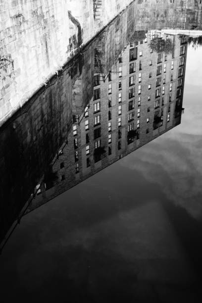 istock reflections on water in Manchester city canal 1804551058