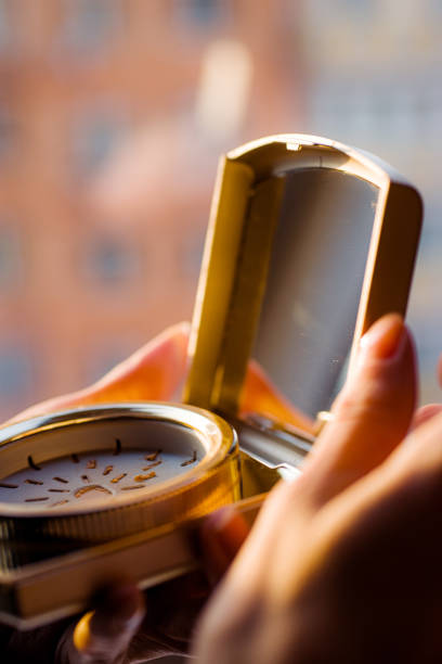 istock Makeup brush, the secret to perfect eyeshadow application, makeup brushes and a large beautiful golden powder compact 1804554859