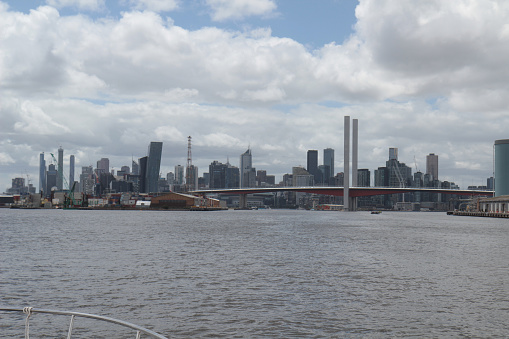 Melbourne, Australia - JAN 14, 2018: View of the Melbourne skyline across the Yarra River. Bolte Bridge in the foreground. Modern skyscrapers and Central Business District (CBD) at background.