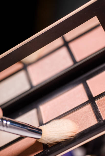 istock Makeup brush, the secret to perfect eyeshadow application, makeup brushes and a large beautiful golden powder compact 1804562967