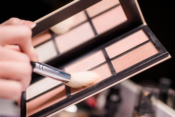 istock Makeup brush, the secret to perfect eyeshadow application, makeup brushes and a large beautiful golden powder compact 1804563131