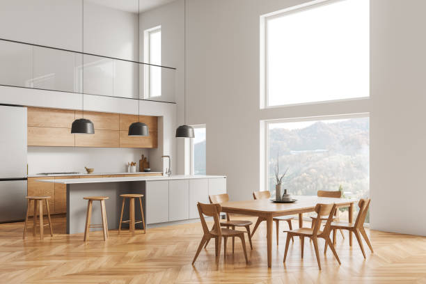 istock Stylish hotel kitchen interior with bar counter and eating zone with window 1804564295