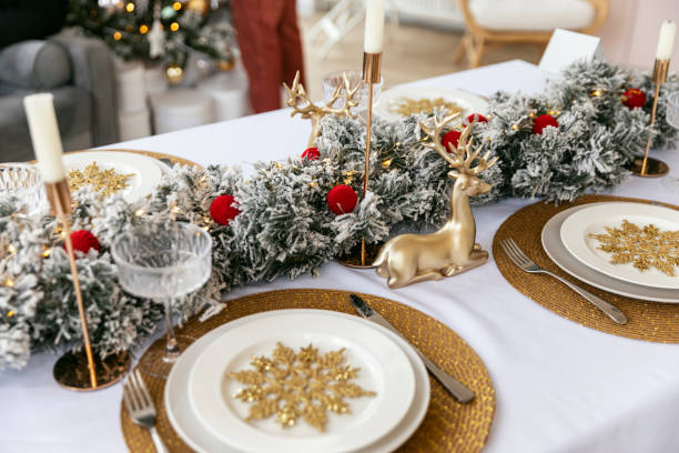 istock Table served for Christmas dinner in living room, close-up view, table setting, Christmas decoration 1804564876