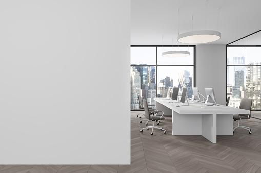 White business interior with pc desktop, coworking zone with armchairs and shared desk on hardwood floor. Panoramic window on New York skyscrapers. Mock up empty partition. 3D rendering