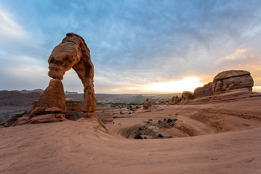 impressive rock formation called Delicate Arch in Arches National Park in the evening at sunset, Utah