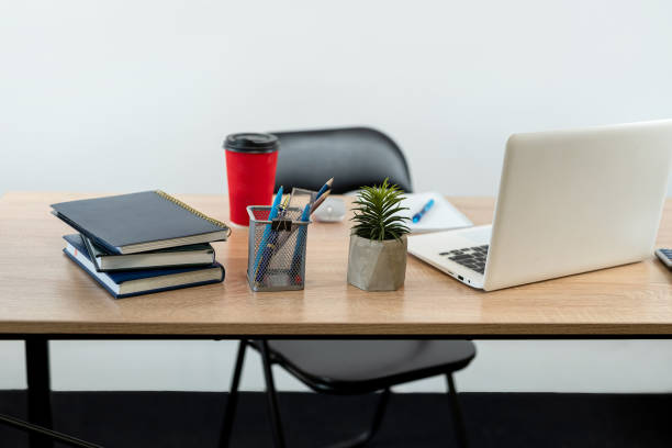 istock Workplace with notepad pen calculator laptop, coffee and keyboard 1804567322