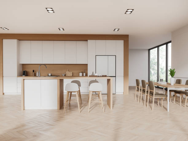 istock Luxury home kitchen interior with dining table and bar counter and window 1804568202