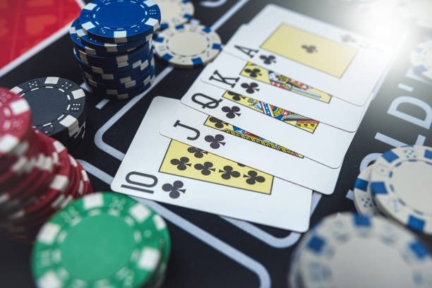 istock The winning combination  Royal flush with chips at casino table 1804571559