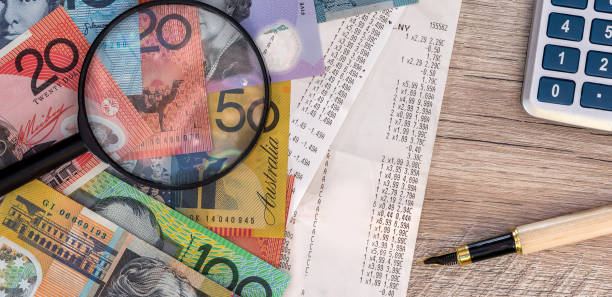 istock Australian dollars with receipt, calculator, pen and magnifier 1804577546