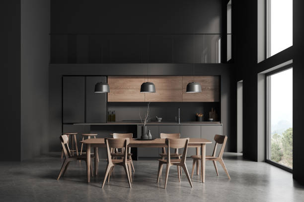 istock Two storey gray kitchen interior with island and table 1804578110