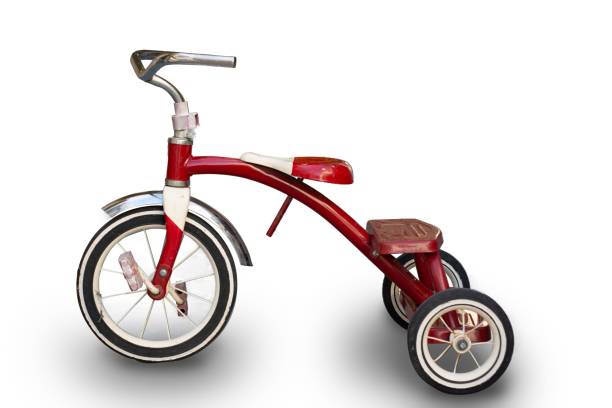 istock Vibrant red tricycle is photographed in a neutral white background 1804590761