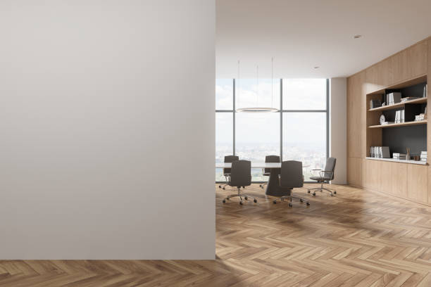 istock White board room interior with bookcase and blank wall 1804591882