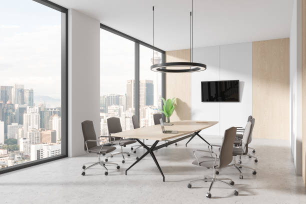 istock White and wooden office board room corner with TV 1804593250