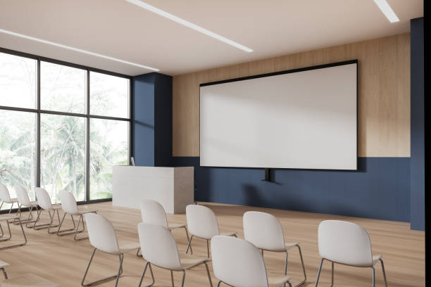 istock Blue and wooden lecture hall corner with projection screen 1804595195