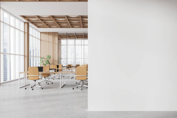 istock White and wooden open space office and board room interior with blank wall 1804600771