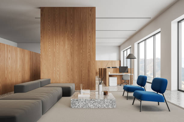 istock Stylish office interior with relax space and window, pc desktop and furniture 1804601833