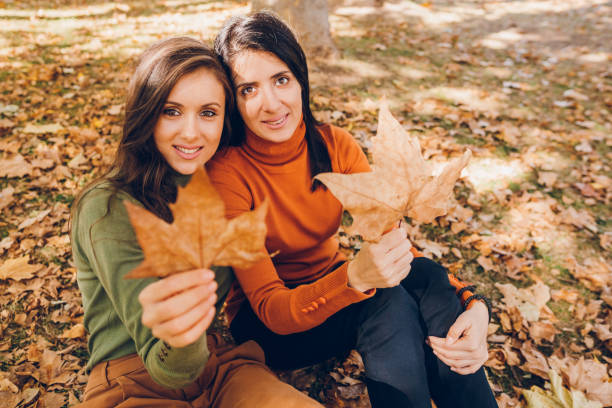 istock Two young woman enjoying autumn 1804605202