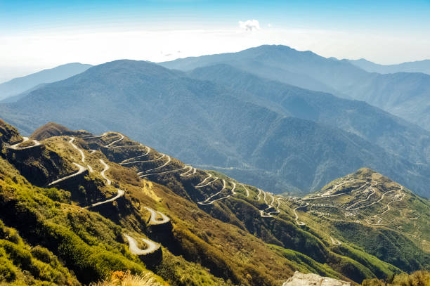 istock Beautiful mountain landscape with road passing through the forest. 1804608468