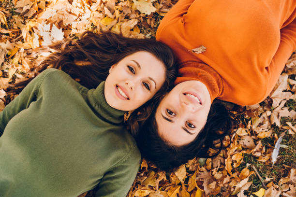 istock Two young woman enjoying autumn 1804609057