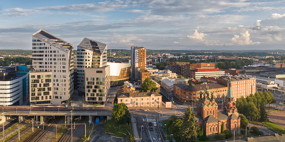 Modern residential buildings in central Tampere next to the Nokia arena. On the right is the Tampere Orthodox Church from 1899.