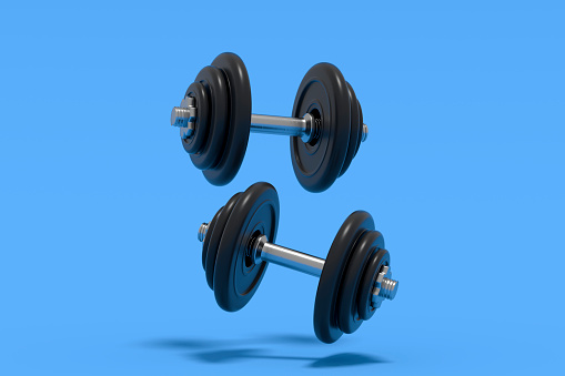 Dumbbell Weights on Blue Background. Digitally generated image.